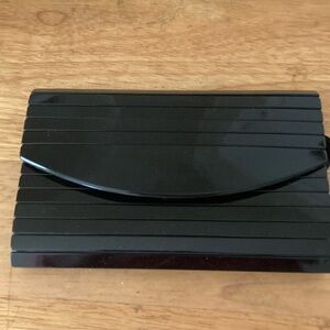 VINTAGE Black Clutch.  Hard exterior. Gold chain.